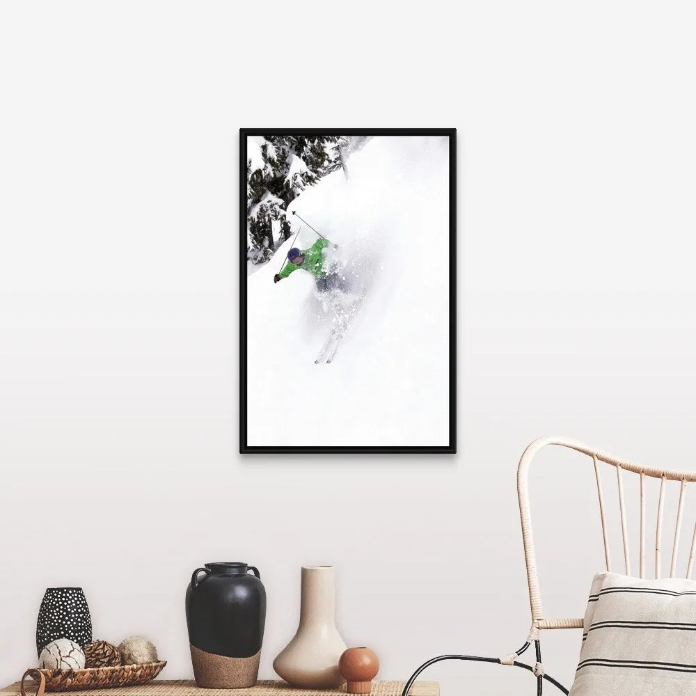 "A free skier skis down a steep hill near trees, kicking up snow." Black Float Frame Canvas Art